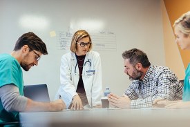 Clinicians reviewing care together